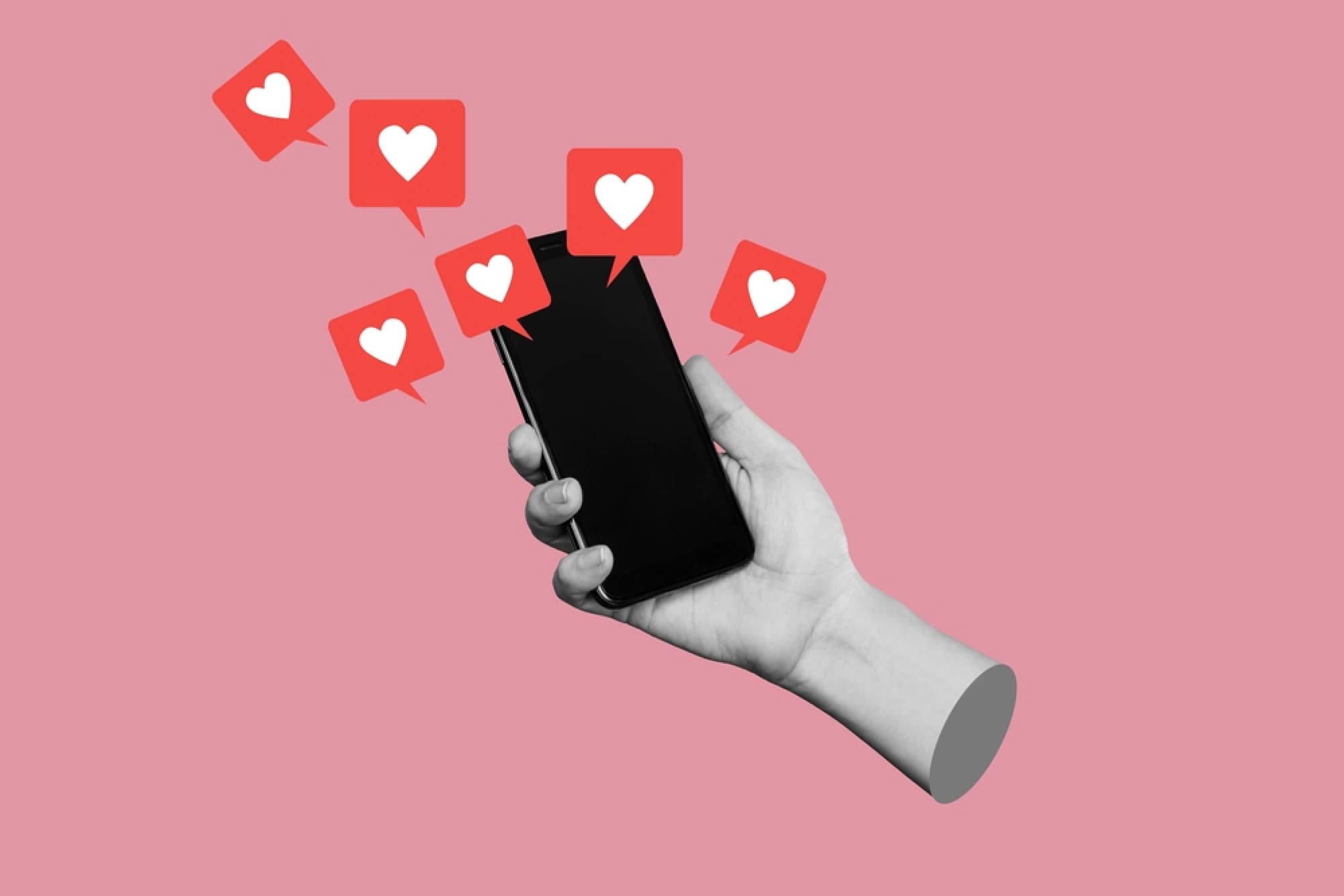 Hand holding a phone showing hearts and likes